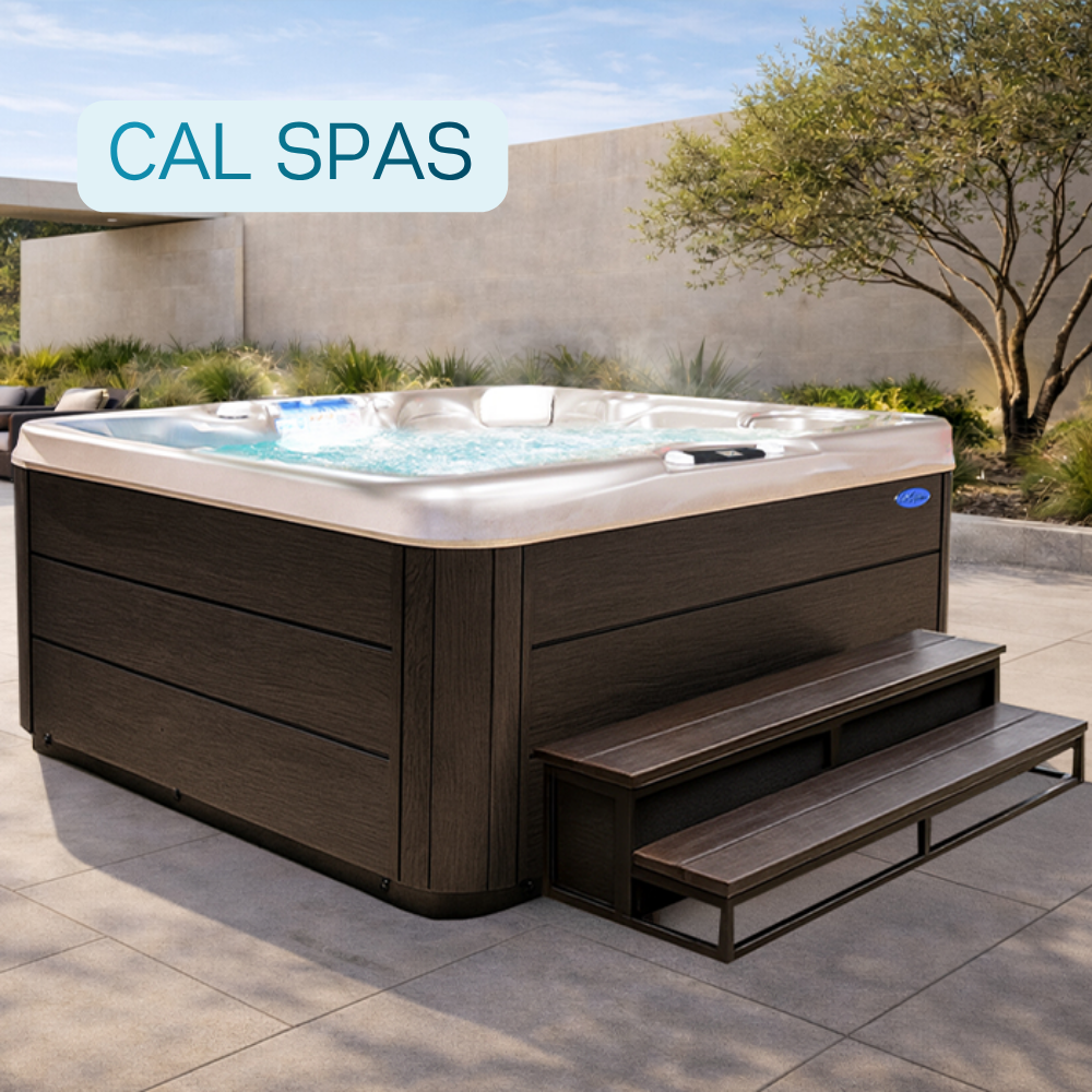 Cal Spas hot tub installed on a modern backyard patio with built-in steps