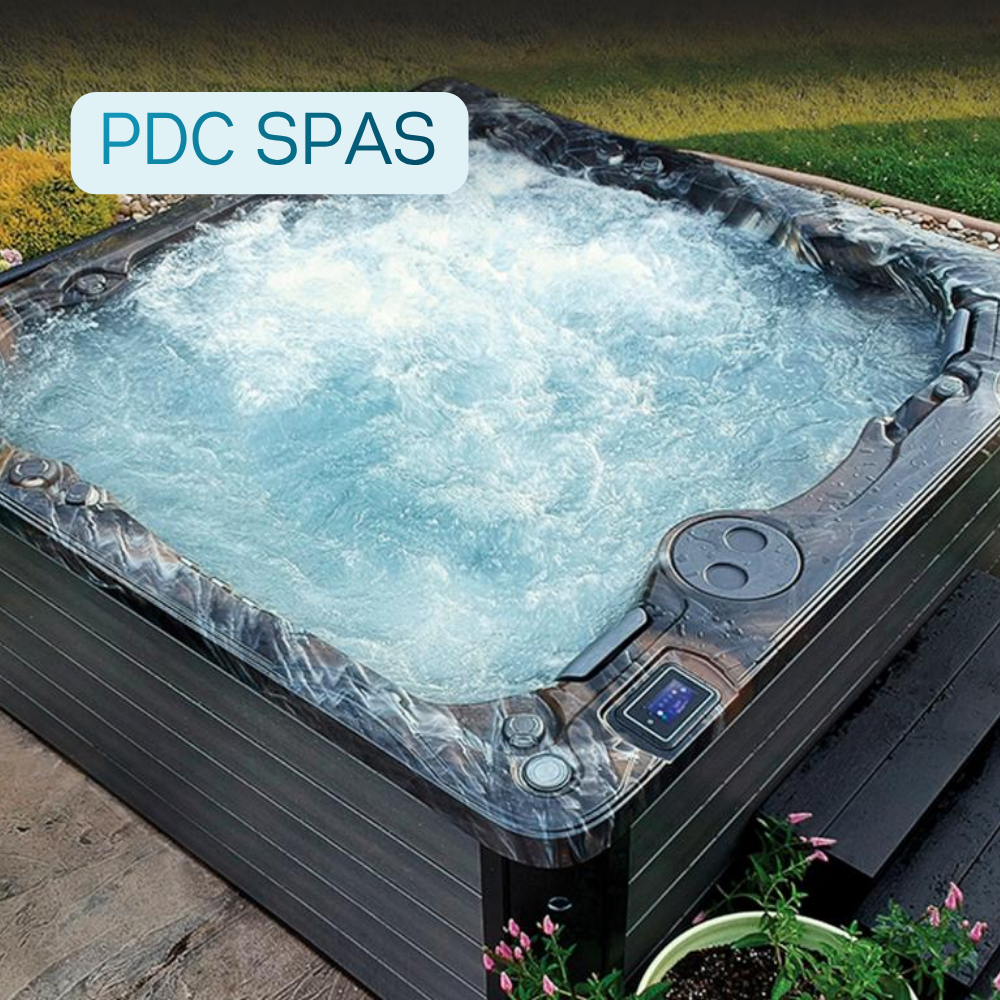 PDC Spas hot tub with bubbling jets in a backyard setting